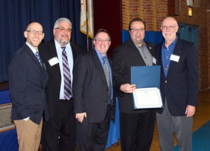 Br. James Norton (right), who spoke about the beginnings of SMILE, accepts a certificate of citation on behalf of the late Br. Ron Marcellin. L-R: Chris Dougherty '91, Ray DiStephan '87, Joe Egan '89, Richard Karsten '81.