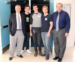 Mr. Dennis Vellucci, Thomas Ashton '12 (center), Patrick McCarthy '12, and President Richard Karsten '81