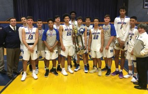 Boys Varsity Basketball Team sport their Marist Invitational trophy.